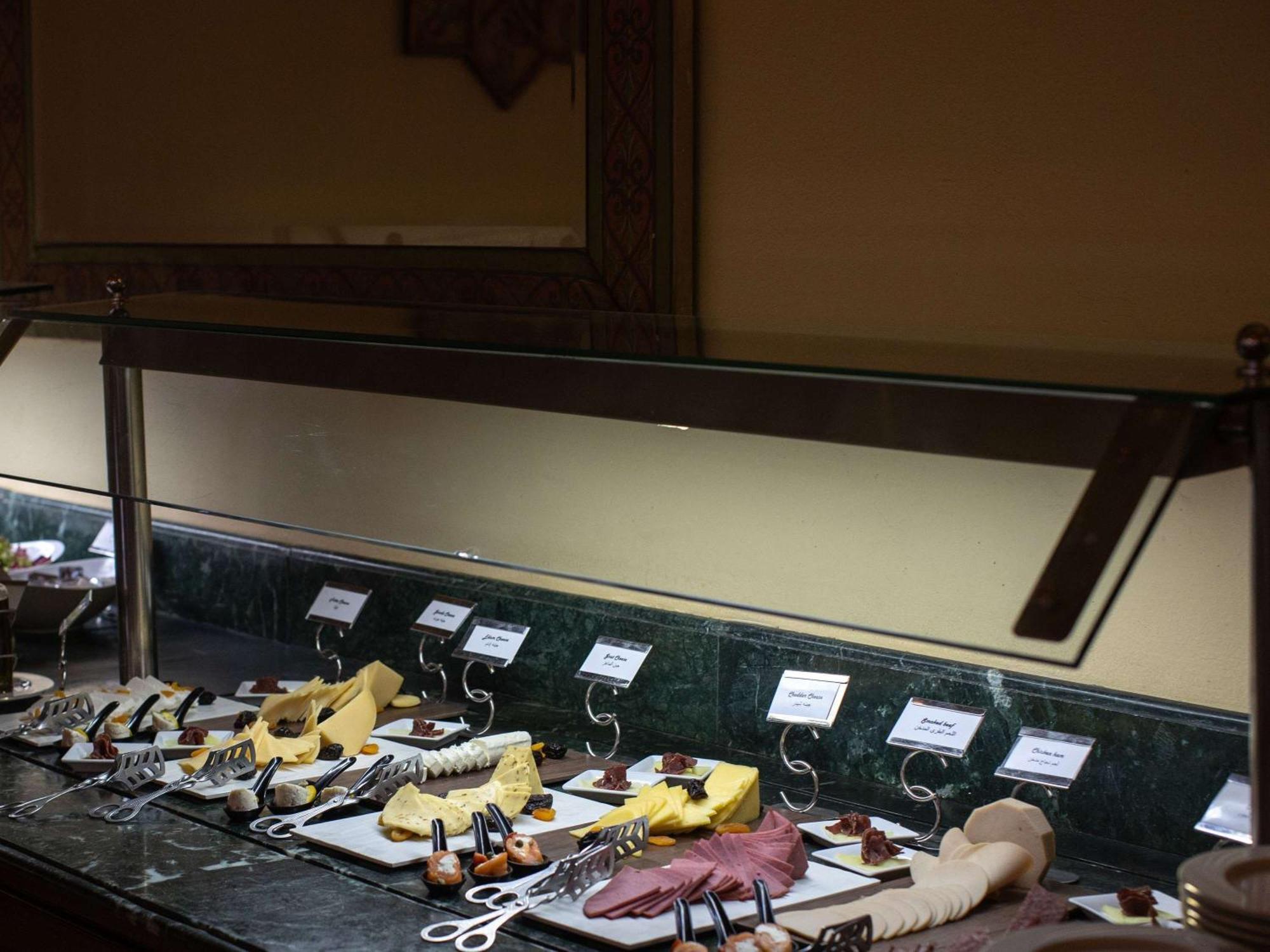 Pavillon Winter Luxor Hotel Екстериор снимка A cheese display at a buffet